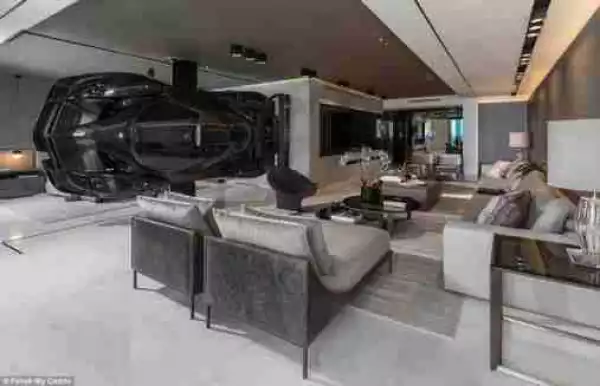 Man Hangs ₦540 Million Super Car From The Ceiling Of His Apartment In U.S (Photos)